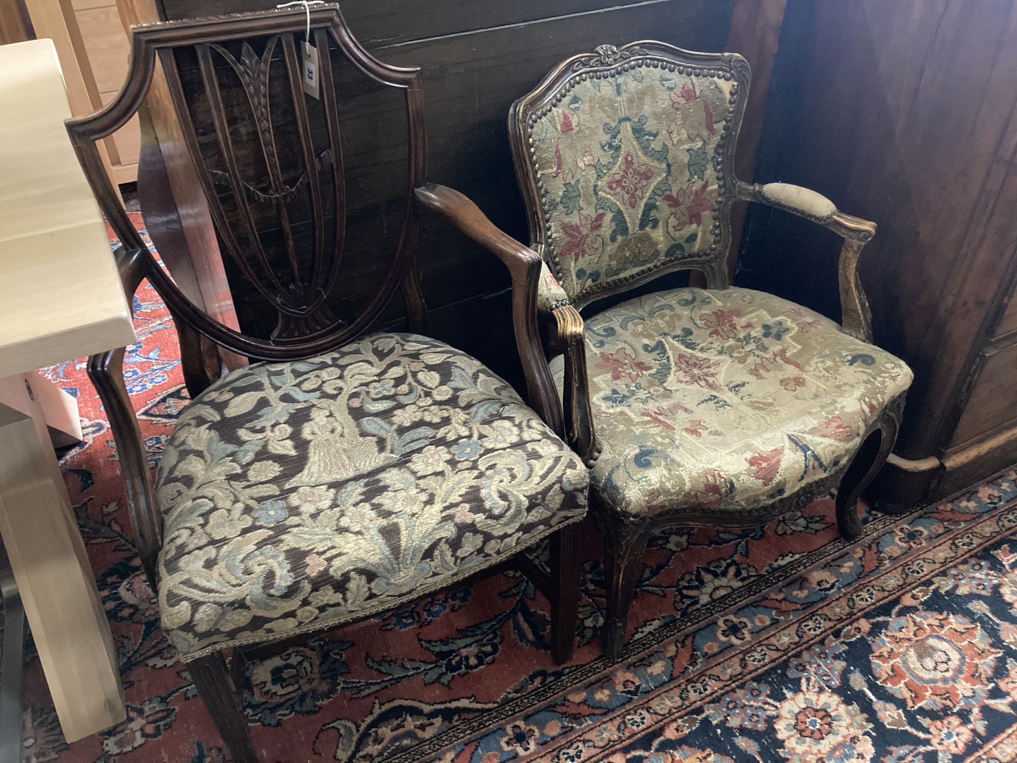 A Hepplewhite style mahogany armchair and a Louis XV walnut fauteuil covered in tapestry